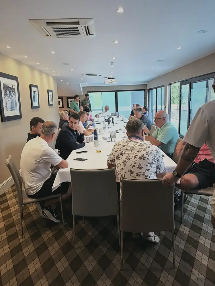 Members around the table at lunch after a Clubhouse golf day at Woburn