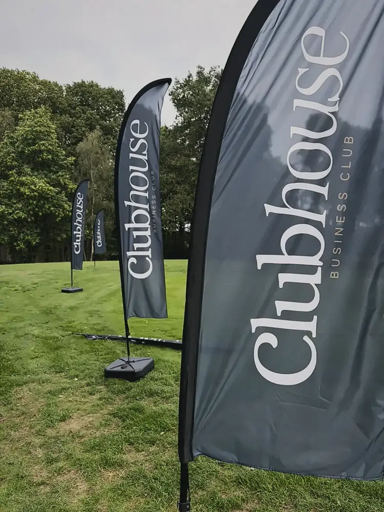 Clubhouse flags lining the fairway at Woburn
